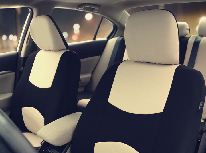 Interior of a car showing beige seat covers installed on the car seat 